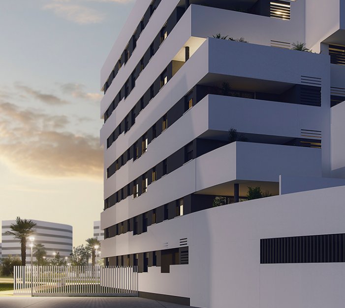 Torre residencial Hacienda Rosario Sevilla al atardecer con iluminación cálida